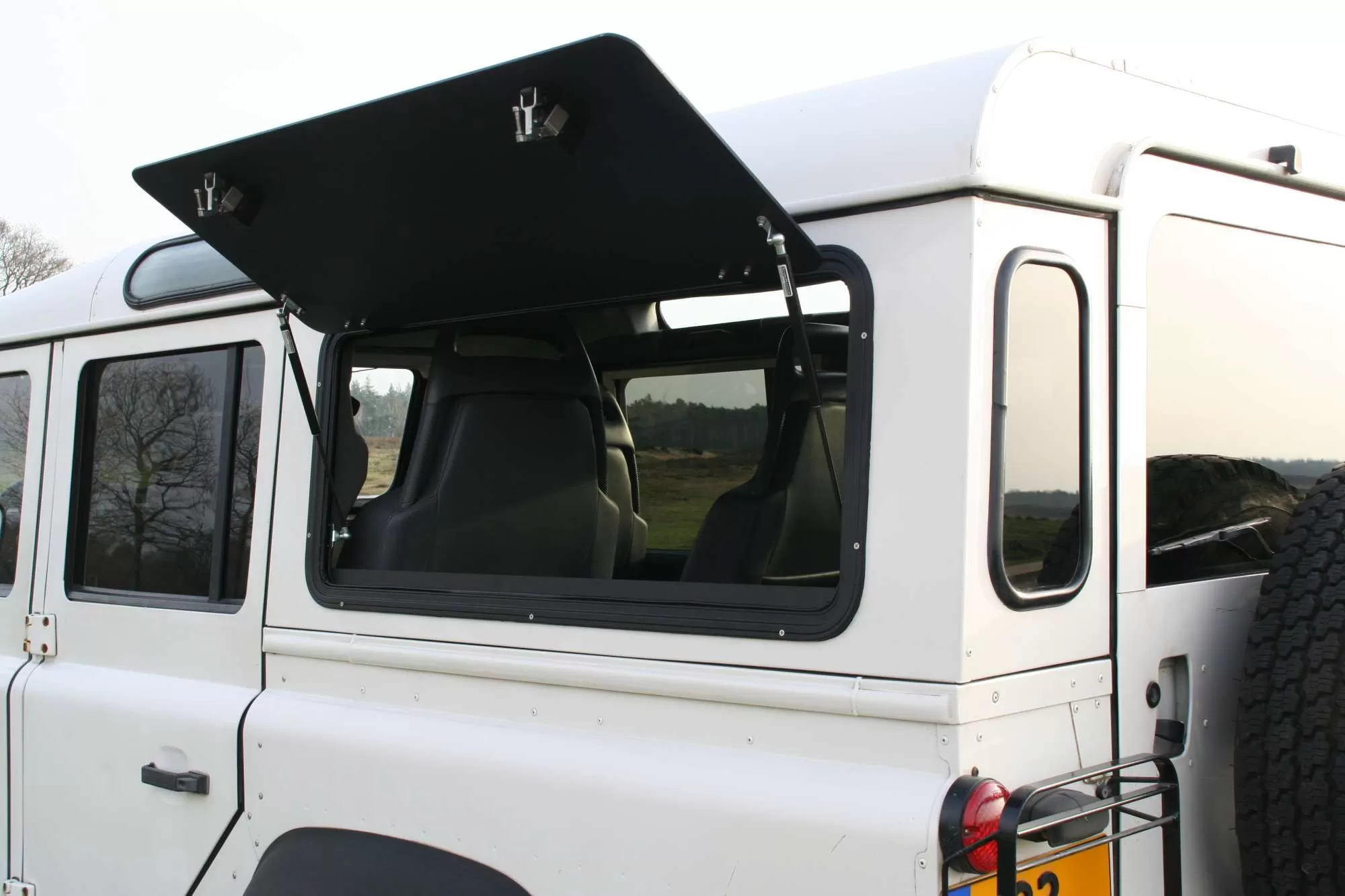 Open Aluminium Gullwing Window by Explore Glazing on a Land Rover Defender.