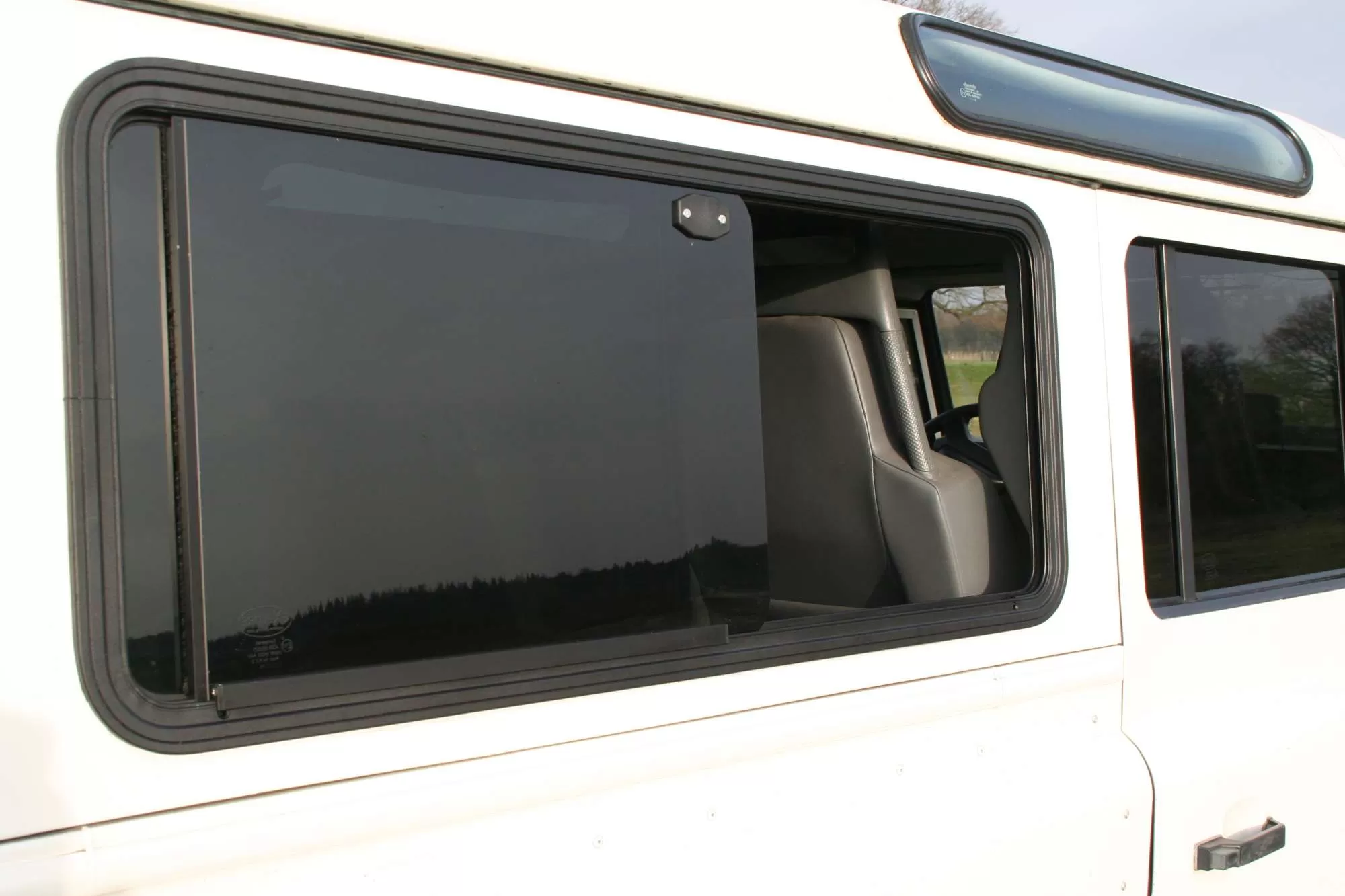 Explore Glazing Land Rover Defender sliding window.