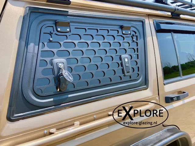 Explore Glazing Jeep Cherokee XJ 5-door gullwing window with a window guard