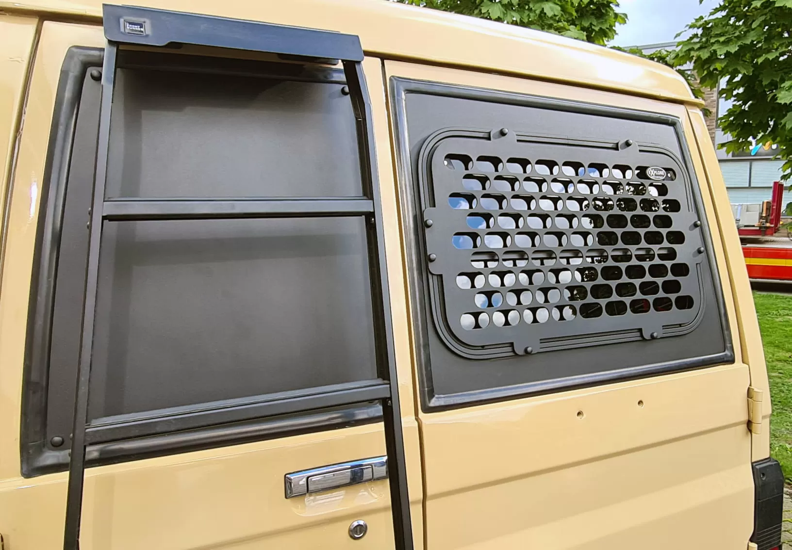 Explore Glazing Toyota 70 Series tail door halfdrop window swing out type - window guard