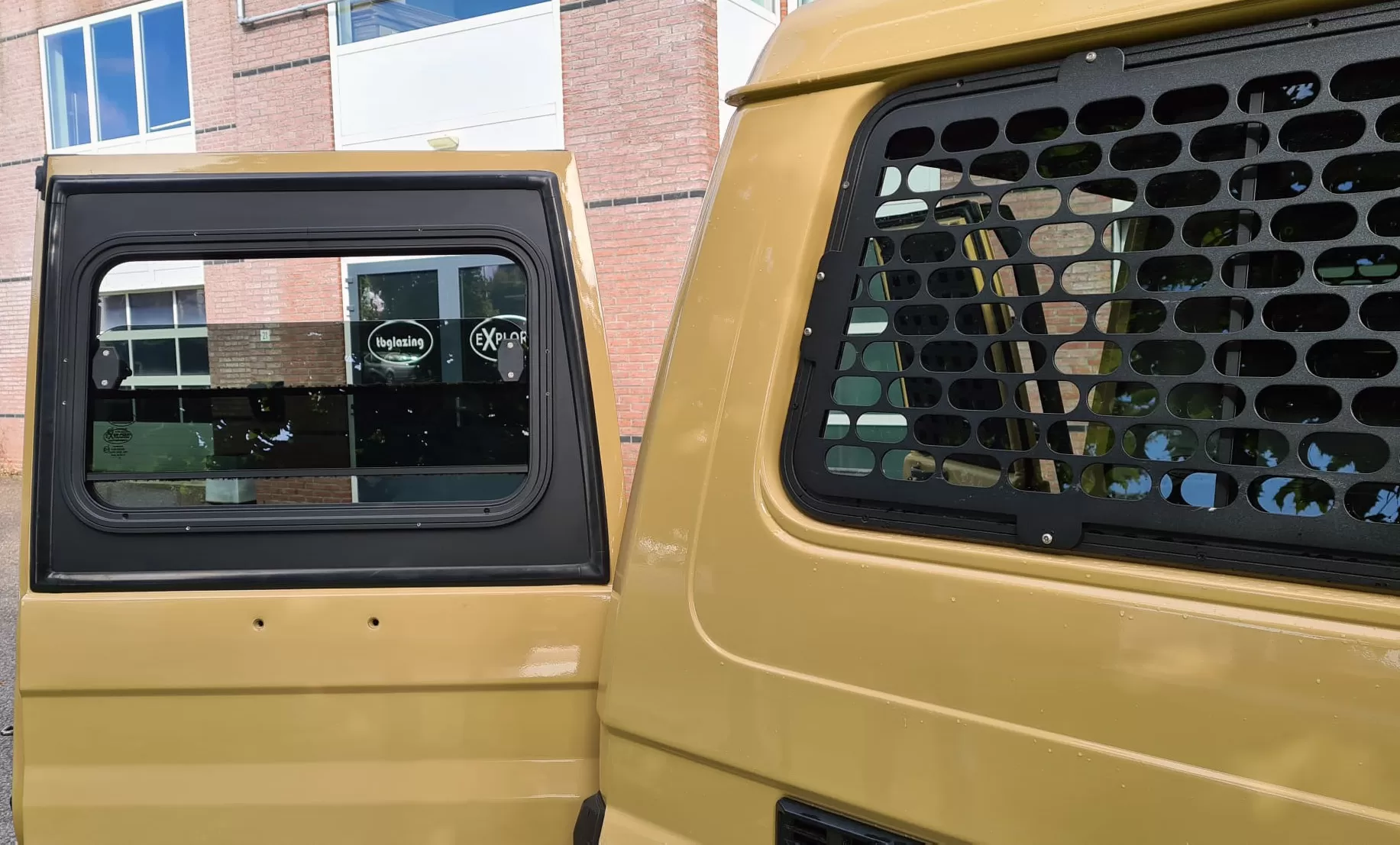 Explore Glazing Toyota 70 Series tail door halfdrop window swing out type
