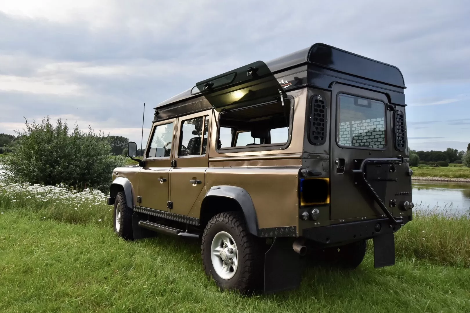 Explore Glazing Land Rover Defender gullwing window.