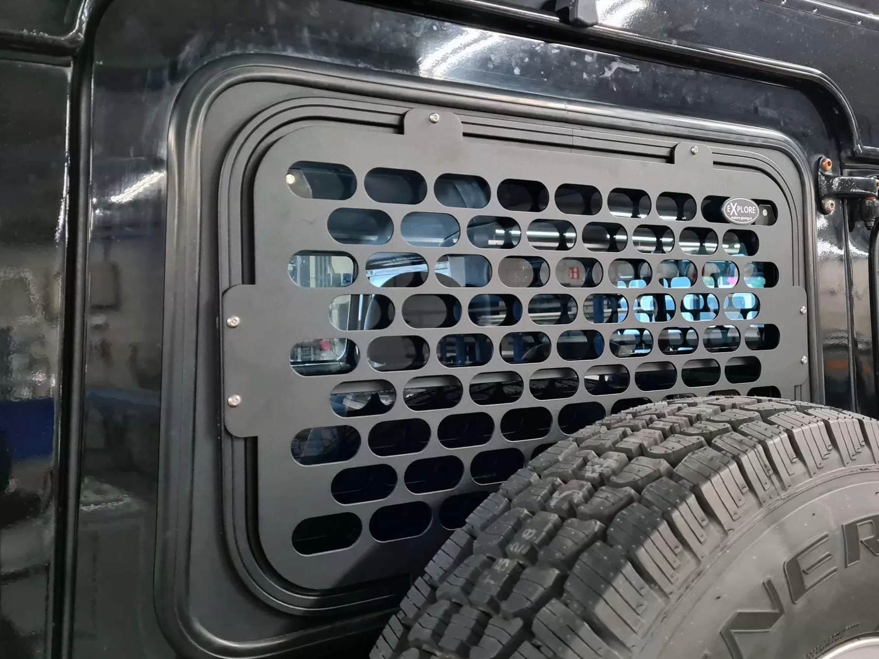 Explore Glazing Land Rover Defender tail door halfdrop window with an external window guard